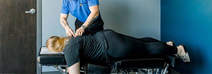 Chiropractic Le Claire IA Woman Receiving Adjustment